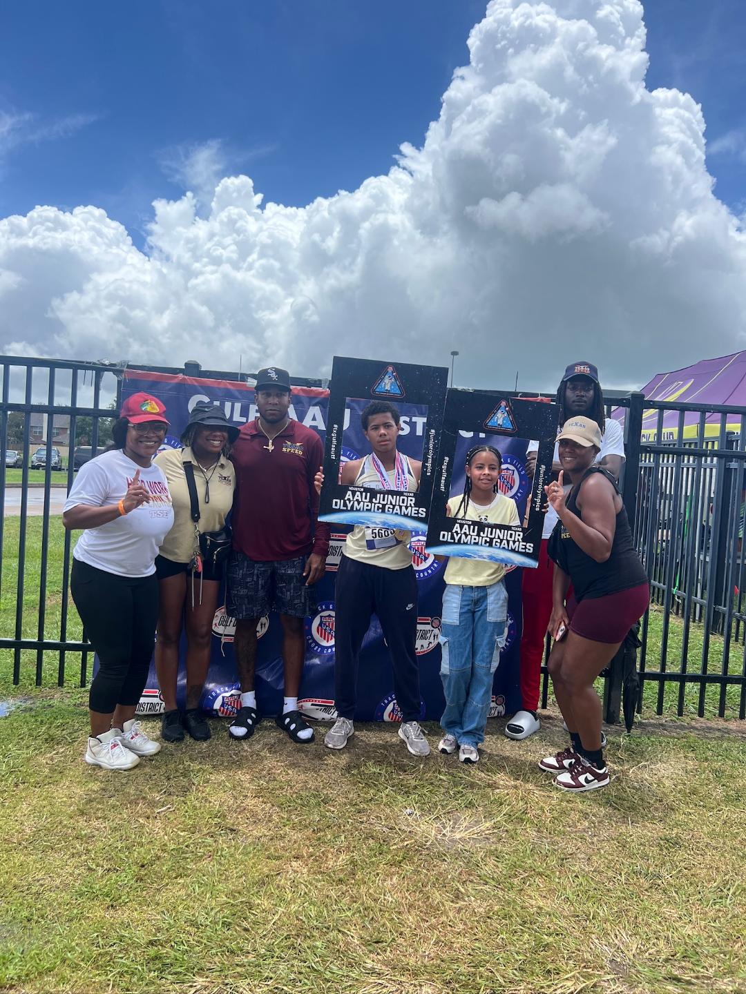 TSE athletes celebrating with medals